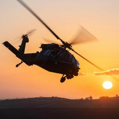 A Sikorsky UH-60 Black Hawk in silhouette against the setting sun. Tagged on Instagram by amitagronov