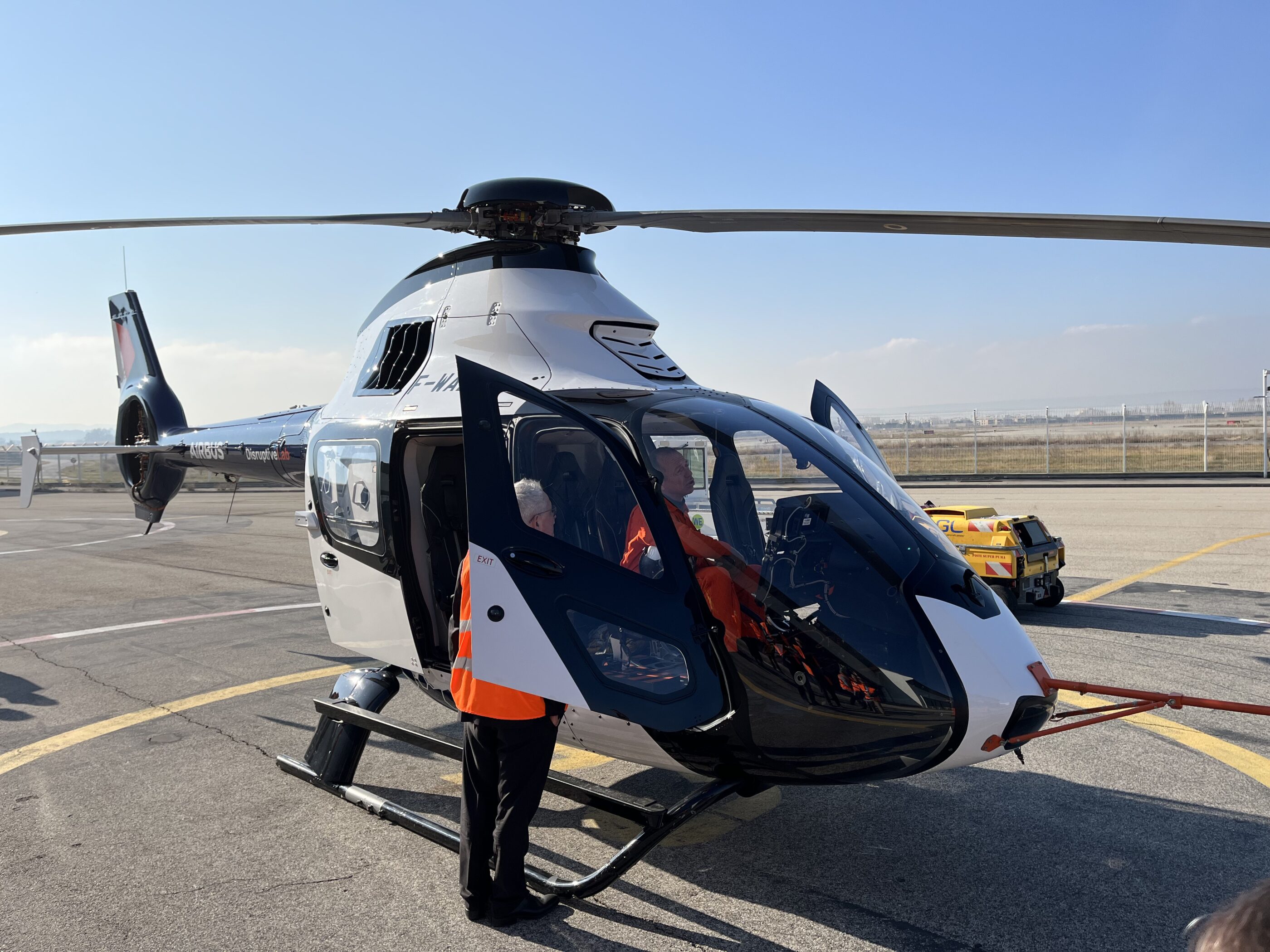 Tomasz Krysinski, Airbus Helicopters' head of research and technology, chats to test pilots of the DisruptiveLab after a flight test. Oliver Johnson Photo