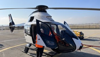 Tomasz Krysinski, Airbus Helicopters' head of research and technology, chats to test pilots of the DisruptiveLab after a flight test. Oliver Johnson Photo
