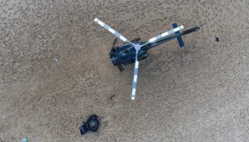 This view from above shows the scale of the damage to the front of XH9, shown on the sandbar alongside XKQ's severed Fenestron. Queensland Police Service Photo
