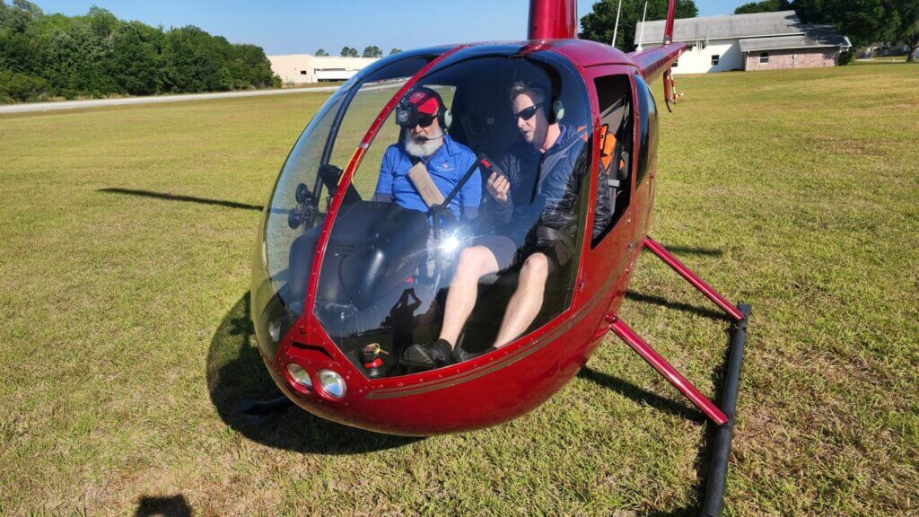 Simon Jones (right) talks a student through a maneuver before they take to the air. Kevin LeClair Photo